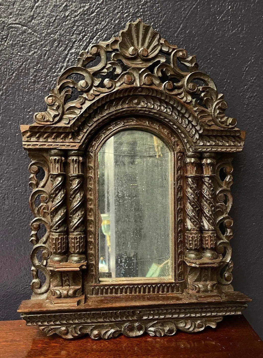A Pair of Small Carved Mirrors