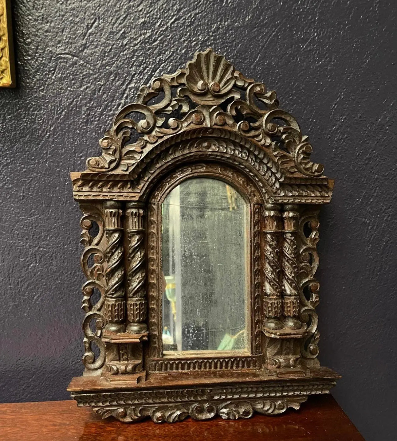 A Pair of Small Carved Mirrors