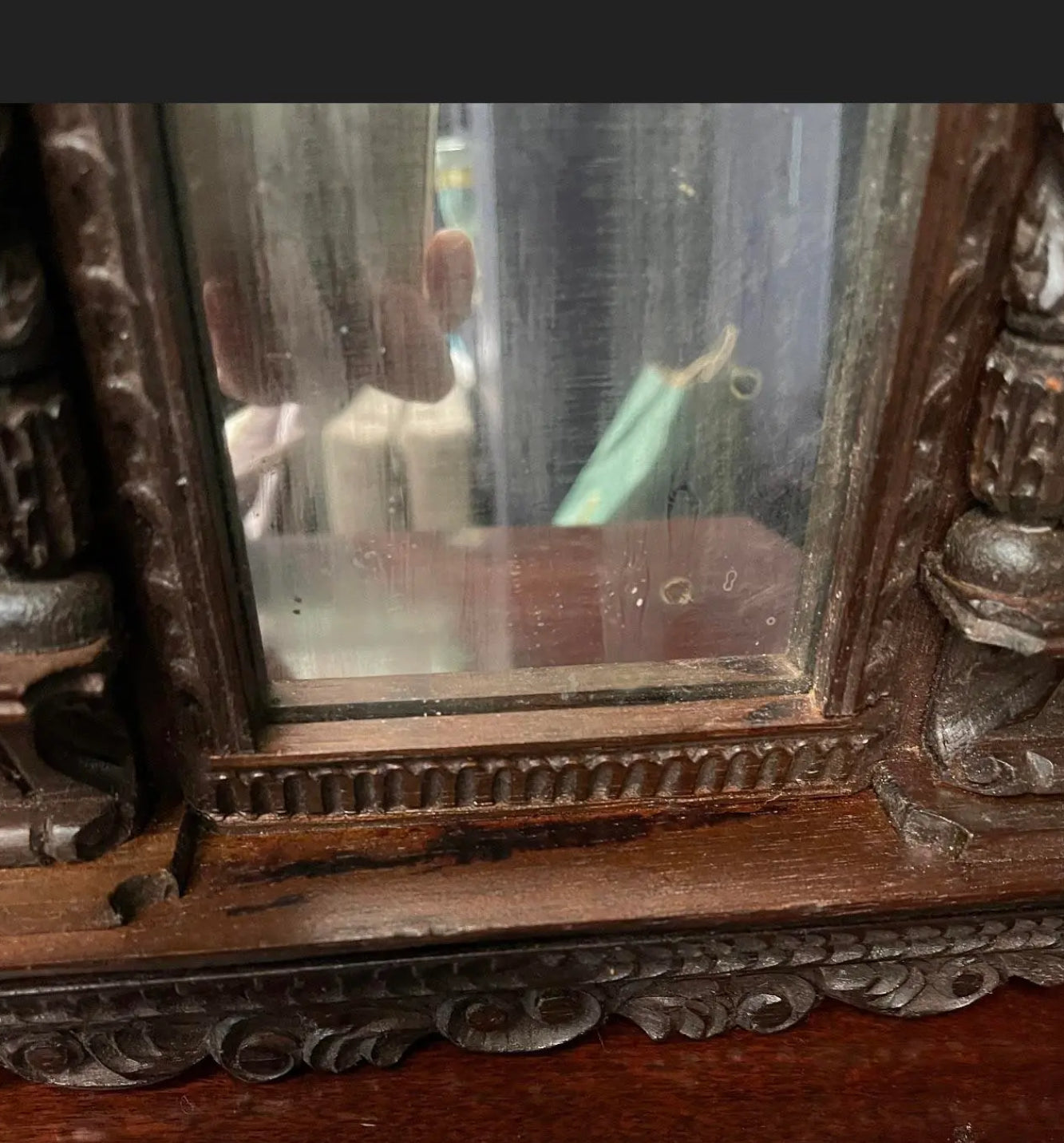 A Pair of Small Carved Mirrors