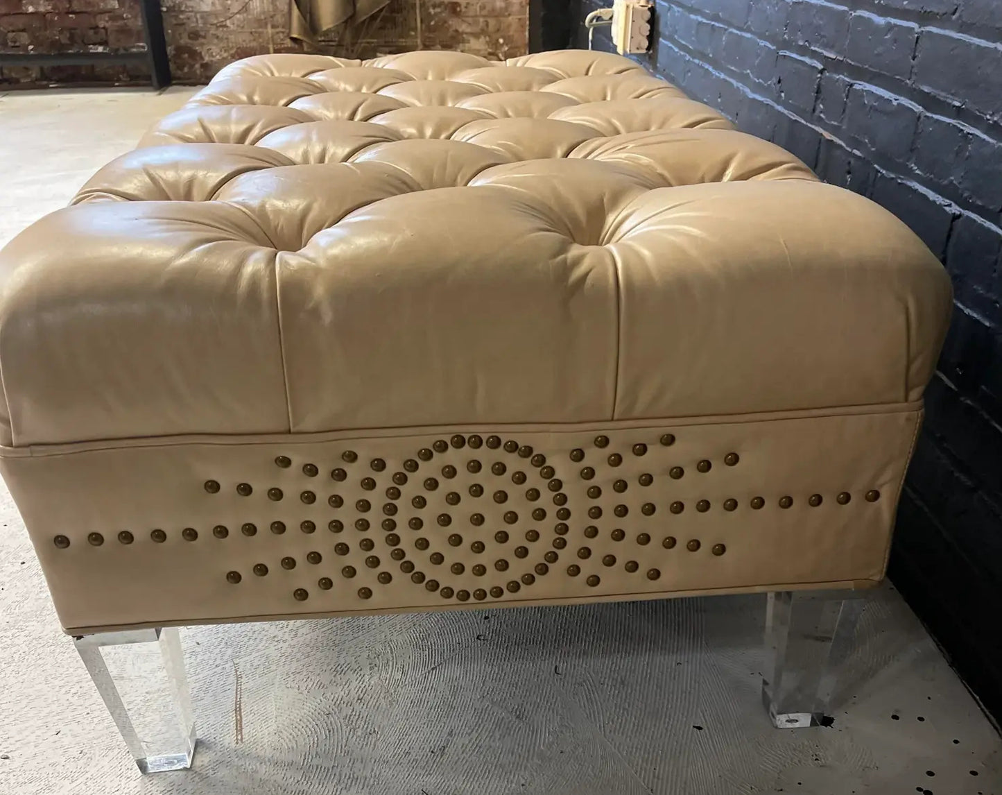 Pre-Owned Laine Cream Leather Ottoman With Brass Tack Embellishments and Lucite Legs