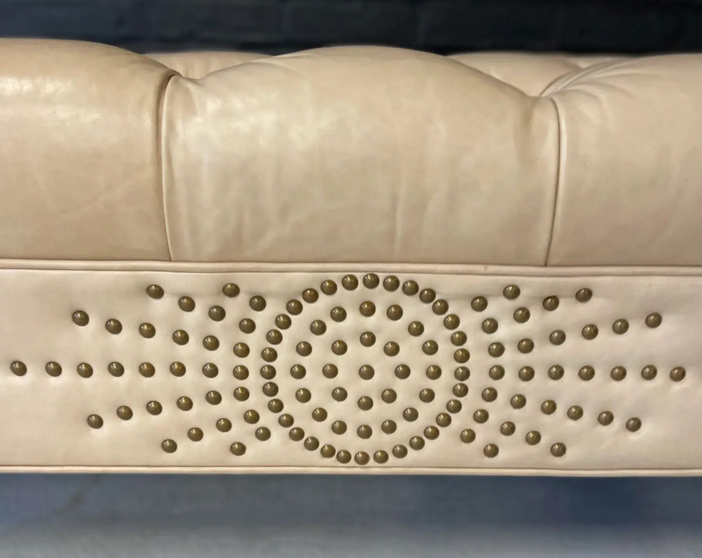 Pre-Owned Laine Cream Leather Ottoman With Brass Tack Embellishments and Lucite Legs